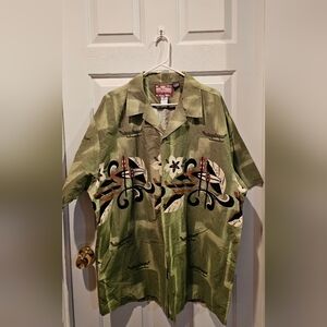 RJC Hawaiian aloha shirt in a green color with a boat/canoe and floral pattern